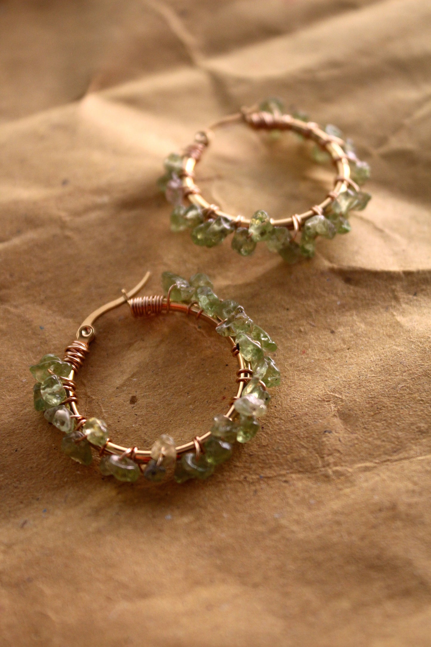Handmade peridot hoop earrings with vibrant green stones and 18K gold plated stainless steel hoops
