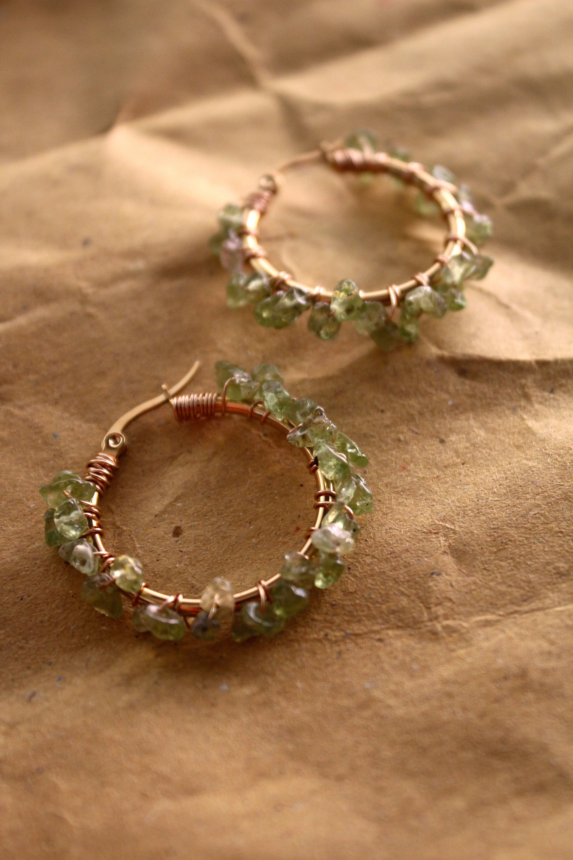 Handmade peridot hoop earrings with vibrant green stones and 18K gold plated stainless steel hoops