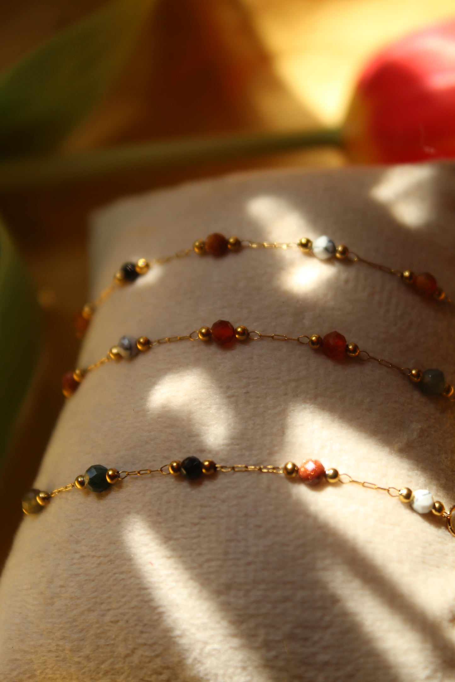 Close-up of beaded gold and earth tones bracelet