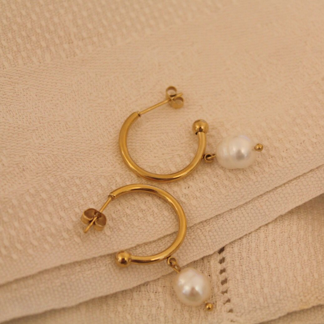 Close-up of Gold Hoop Earrings with Pearls