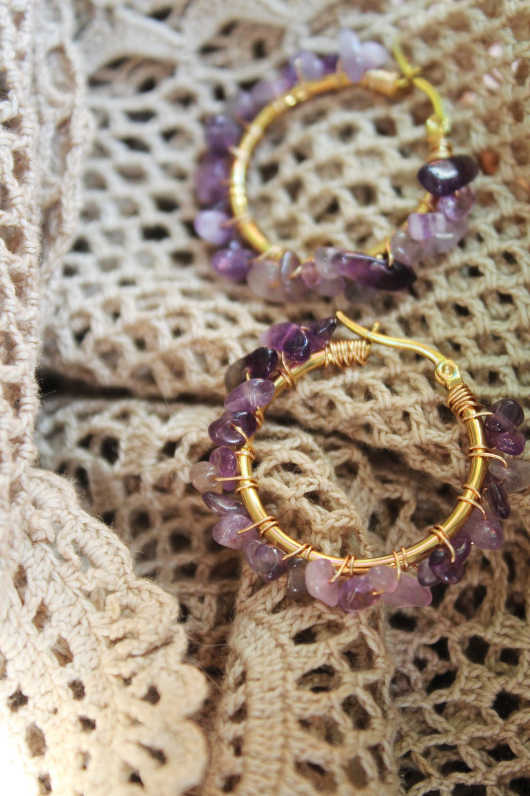 Natural amethyst hoop earrings in soft light, purple gemstone jewelry with calm aesthetic