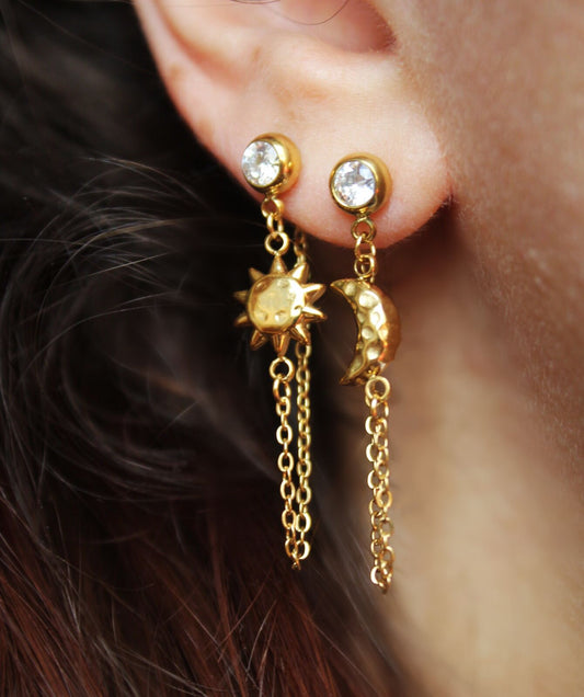 Gold mismatched sun and moon earrings