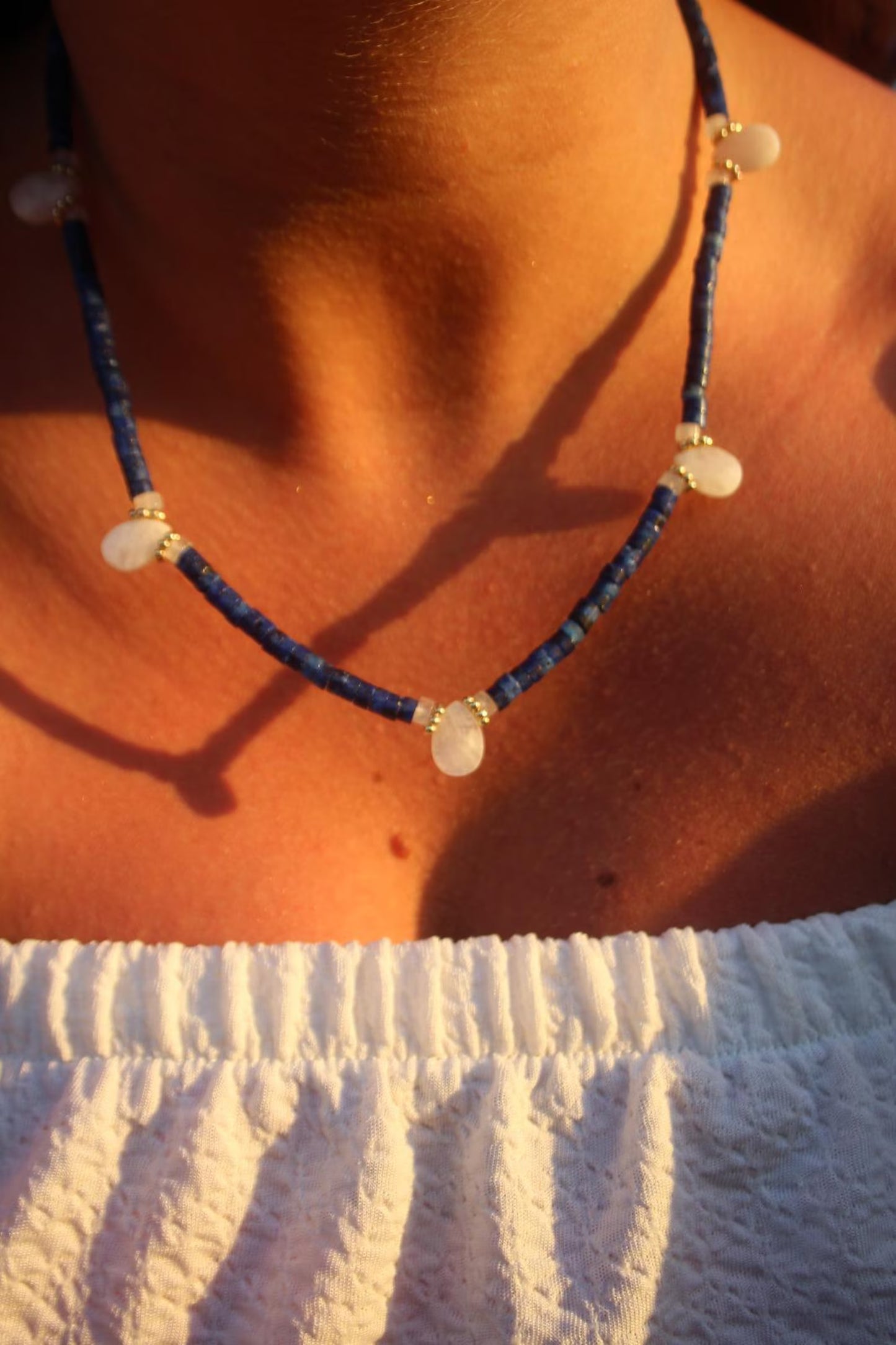 Lapis lazuli and moonstone necklace with deep blue tones and a teardrop pendants