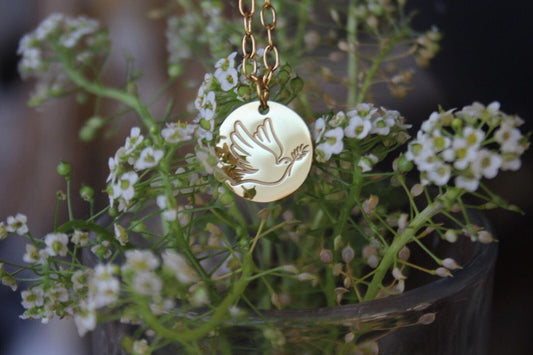 A delicate Gold Dove Necklace